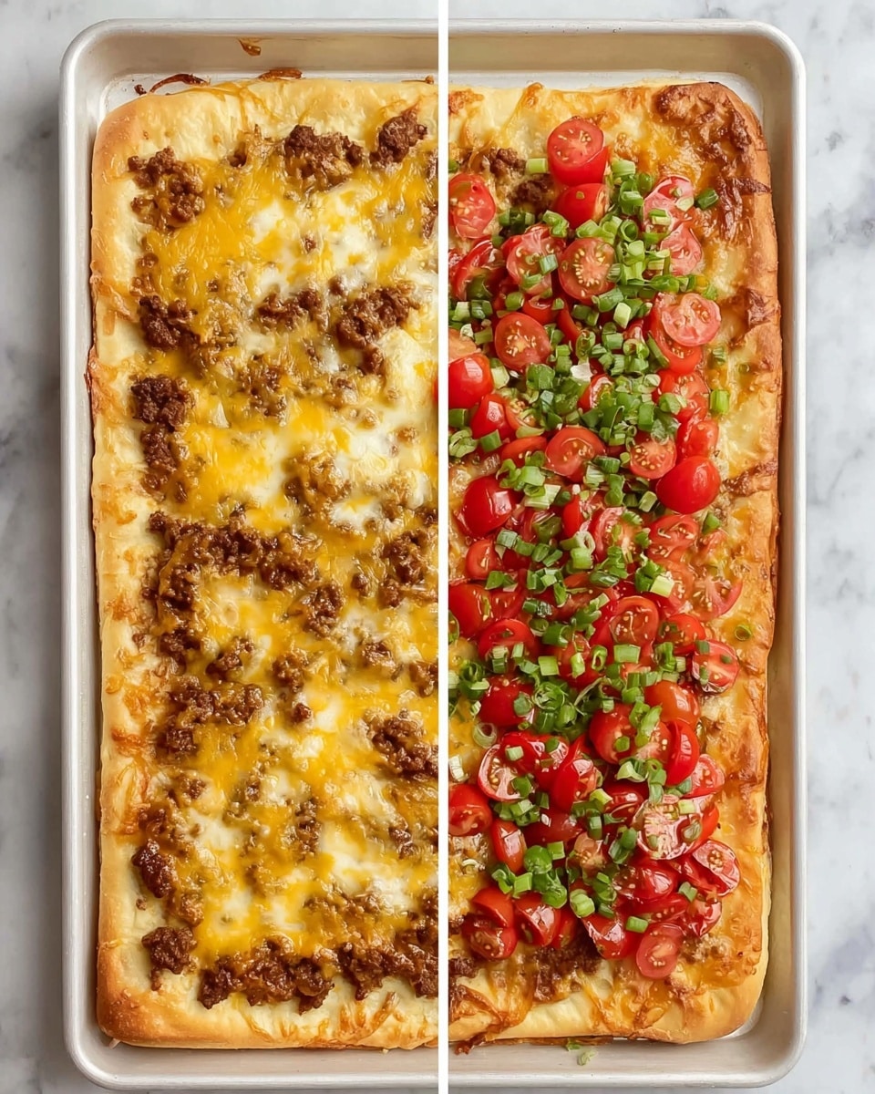 A rectangular pizza with a thick golden crust on a white baking tray is shown in two halves. The left half has a base layer of melted yellow cheese mixed with browned ground meat, evenly spread across the dough. The right half has the same cheesy meat layer but is topped with bright red halved cherry tomatoes and scattered green chopped scallions, adding a fresh and colorful contrast. The tray sits on a white marbled surface. photo taken with an iphone --ar 4:5 --v 7