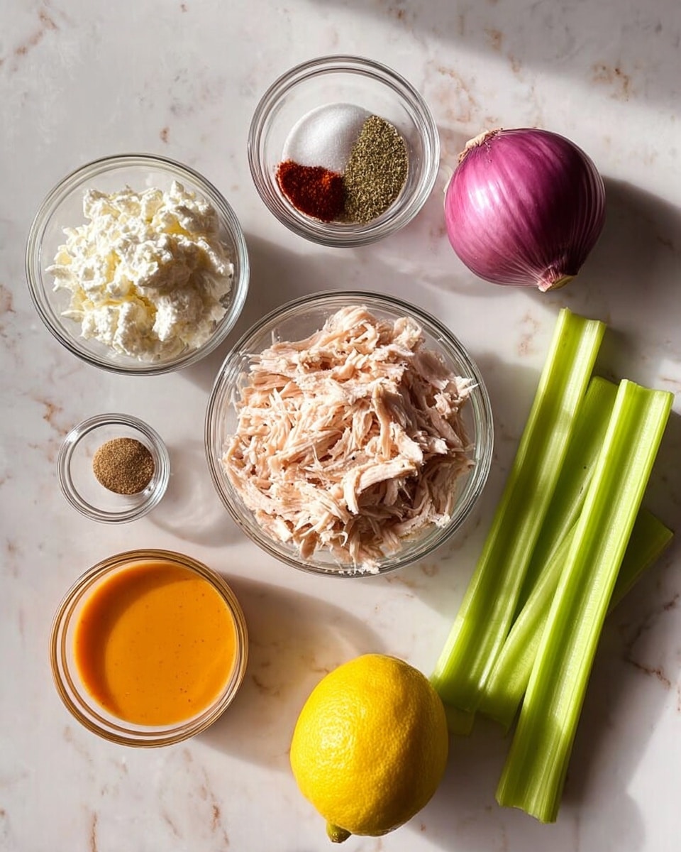 The image shows six clear glass bowls and some fresh ingredients arranged on a white marbled surface. In the center is a medium bowl filled with shredded light pink chicken. Above it is a small bowl with salt, black pepper, red spice, and garlic powder arranged in sections. To the left is a bowl of white cottage cheese with a soft texture, and below that is a bowl with smooth, bright orange sauce. A whole bright yellow lemon is placed below the chicken bowl. On the right side, there are three fresh, crisp green celery stalks and a quarter piece of red onion with purple and white layers visible. The arrangement is neat and clean, with natural light highlighting the colors and textures of each ingredient. Photo taken with an iphone --ar 4:5 --v 7