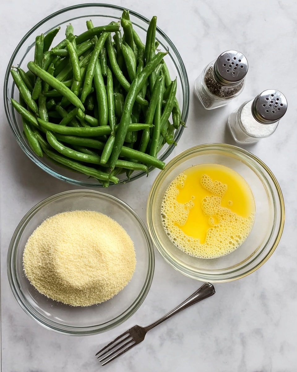 The image shows a clear glass bowl filled with fresh, whole green beans on the left side. To the right of this bowl, there are two smaller clear glass bowls placed side by side; the top one contains lightly beaten yellow eggs with bubbles, and the bottom one has a pile of fine, pale yellow breadcrumbs. Next to these bowls, there are two small glass shakers, one filled with black pepper and the other with white salt. Below the bowls and shakers, a silver fork lies flat on a white marbled surface. Photo taken with an iphone --ar 4:5 --v 7