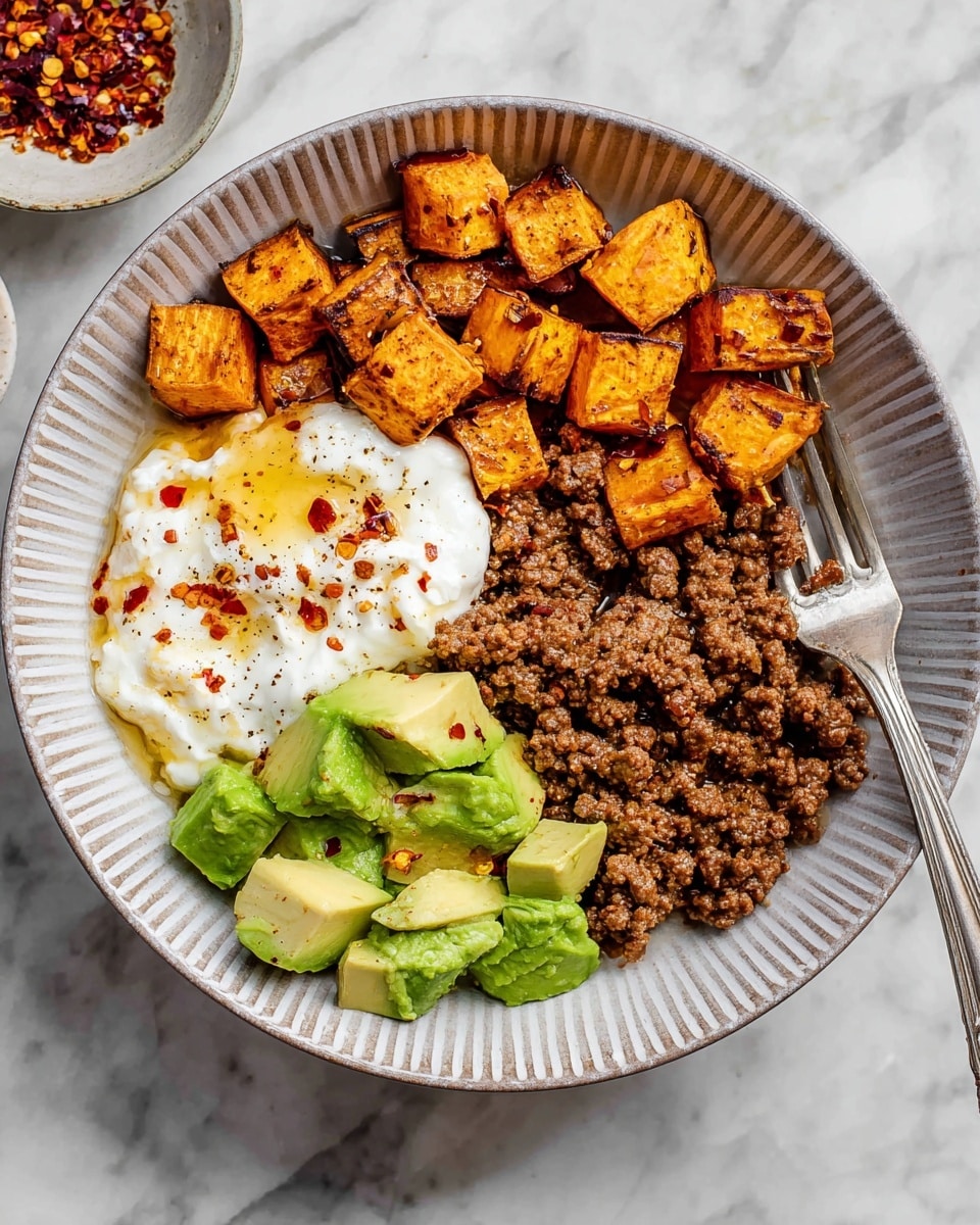 The image shows a white bowl with four main layers of food, each placed in separate sections. Starting from the left, there is a layer of small orange-brown cubes with a crisp texture that looks roasted. Next to it is a white creamy layer topped with small red flakes and a drizzle of golden syrup. To the right of that, there is a layer of finely ground brown meat mixed with spices. The last section features bright green chunks of avocado sprinkled with red flakes. A silver spoon rests on the left side of the bowl. In the background, there is a small white bowl filled with honey and a wooden honey dipper, all placed on a white marbled texture. photo taken with an iphone --ar 4:5 --v 7