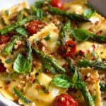 Ravioli with Tomatoes, Asparagus, Garlic, and Herbs Recipe
