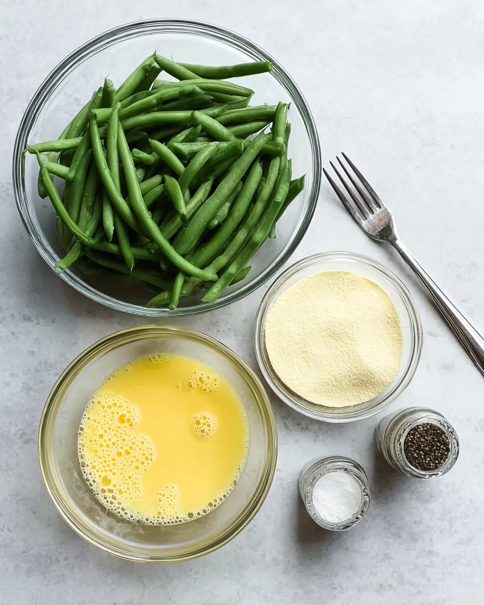 The image shows four clear glass bowls on a white marbled surface. The largest bowl contains fresh, raw green beans, layered loosely and filling the bowl halfway. Next to it is a smaller bowl with a mixture of beaten eggs, showing a smooth yellow texture with bubbles on top. Below, there is another bowl filled with a fine, pale yellow powder, likely an ingredient for coating or seasoning. Two small glass shakers are placed to the right, one filled with black pepper and the other with white salt. A silver fork lies beneath the bowls along the surface. Photo taken with an iphone --ar 4:5 --v 7