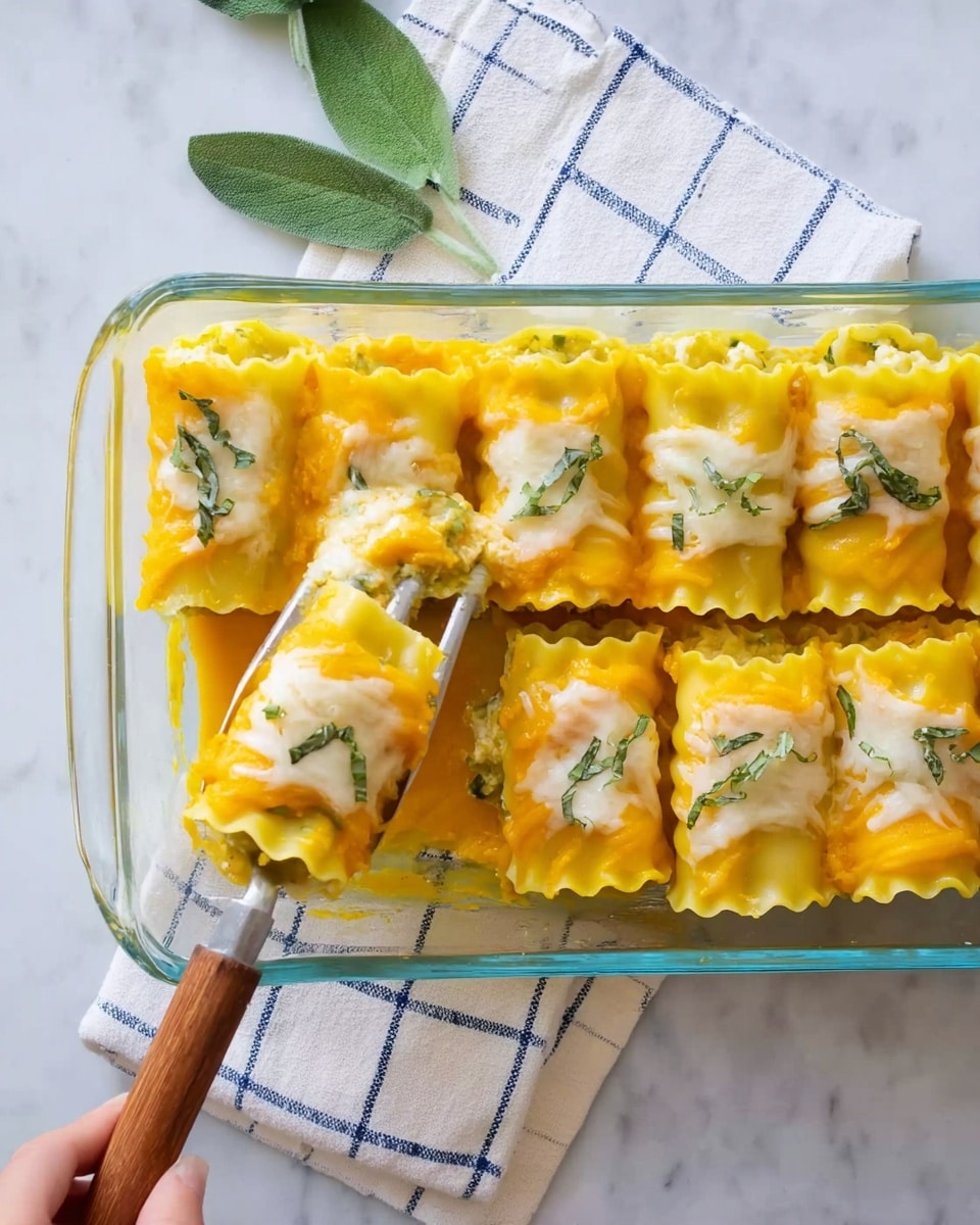 Two rows of stuffed pasta rolls sit in a clear glass baking dish on a white marbled surface. Each pasta roll has three layers: the outer bright yellow pasta with ruffled edges, a smooth, creamy light orange filling layer underneath, and melted white cheese patches on top, garnished with small green herb pieces. One roll is sliced with a woman’s hand holding a spatula lifting a portion. A white napkin with a blue grid pattern and green leaves lie nearby. Photo taken with an iphone --ar 4:5 --v 7