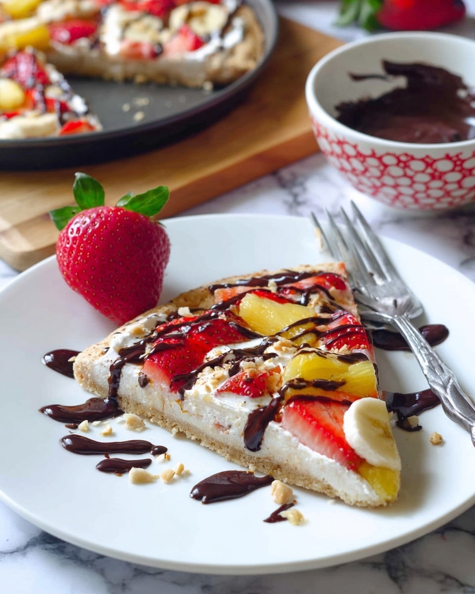 The image shows a round dessert pizza on a white plate with a thin golden crust. The pizza has three main layers of fruit arranged in rings: the outer ring is made of light yellow banana slices, the middle ring is red strawberry slices, and the inner ring is yellow pineapple chunks. In the very center is a whole red strawberry with green leaves. The whole pizza is covered with cream and drizzled with dark chocolate sauce in thin lines across the top. Small bits of crushed nuts are sprinkled over the pizza. The plate is set on a white marbled surface with scattered whole strawberries and a banana nearby. Photo taken with an iphone --ar 4:5 --v 7