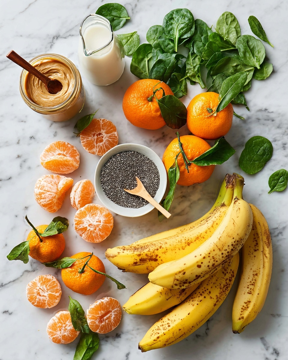 A spread of fresh fruits and ingredients is arranged on a white marbled surface. On the bottom right, three ripe yellow bananas with brown spots lie together. Above them, a white bowl filled with small black and white chia seeds has a small wooden spoon resting inside. To the left of the bowl, there are bright orange peeled and segmented mandarin pieces, with whole mandarins still attached to green leafy stems placed around them. Fresh green spinach leaves are scattered across the top right area. On the upper left, there is a small glass jug of milk and next to it a glass jar with a wooden-spoon handle covered in creamy nut butter. The whole setup is bright and fresh, with vibrant colors against the clean white marbled surface. Photo taken with an iphone --ar 4:5 --v 7