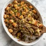 Cornbread Stuffing with Savory Sausage, Herbs, and Pecan Halves Recipe